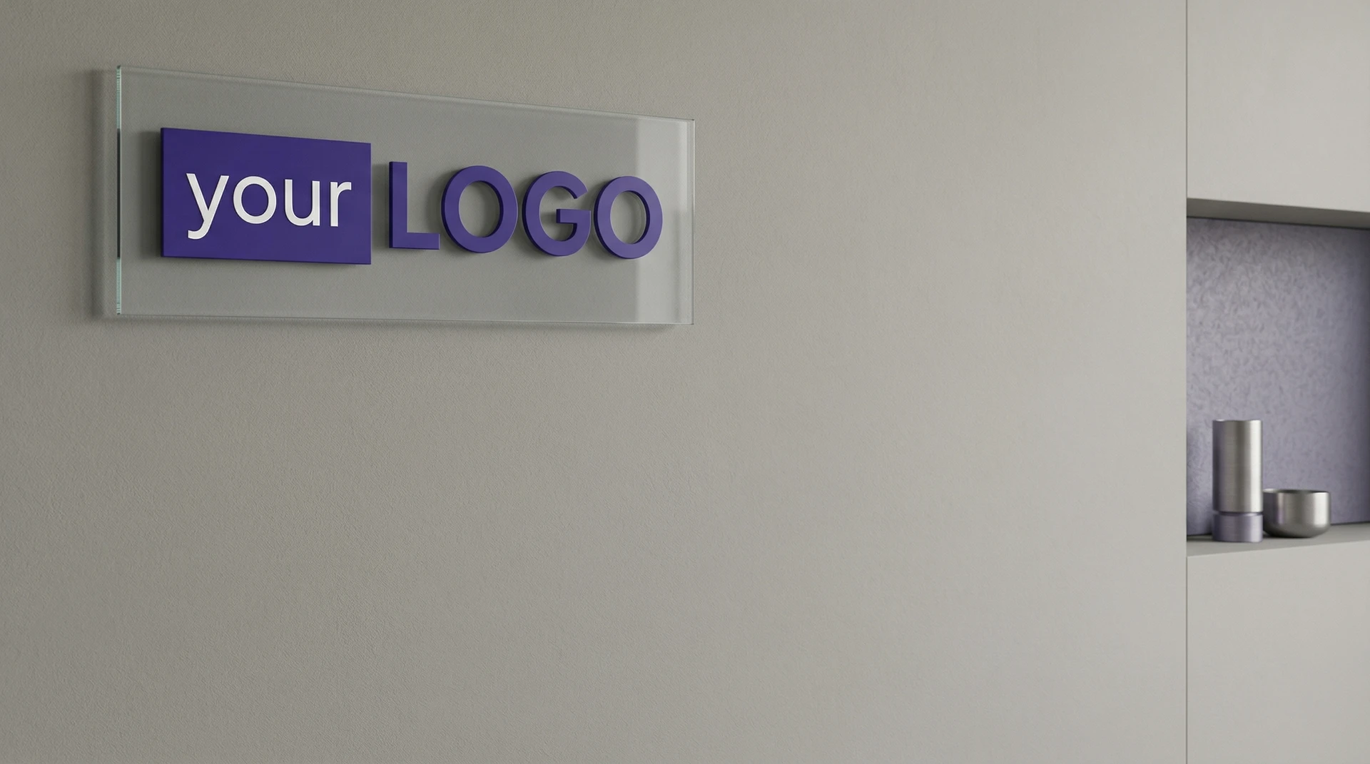 Modern minimalist wall with a glass plaque displaying a purple logo and clean neutral office decor.
